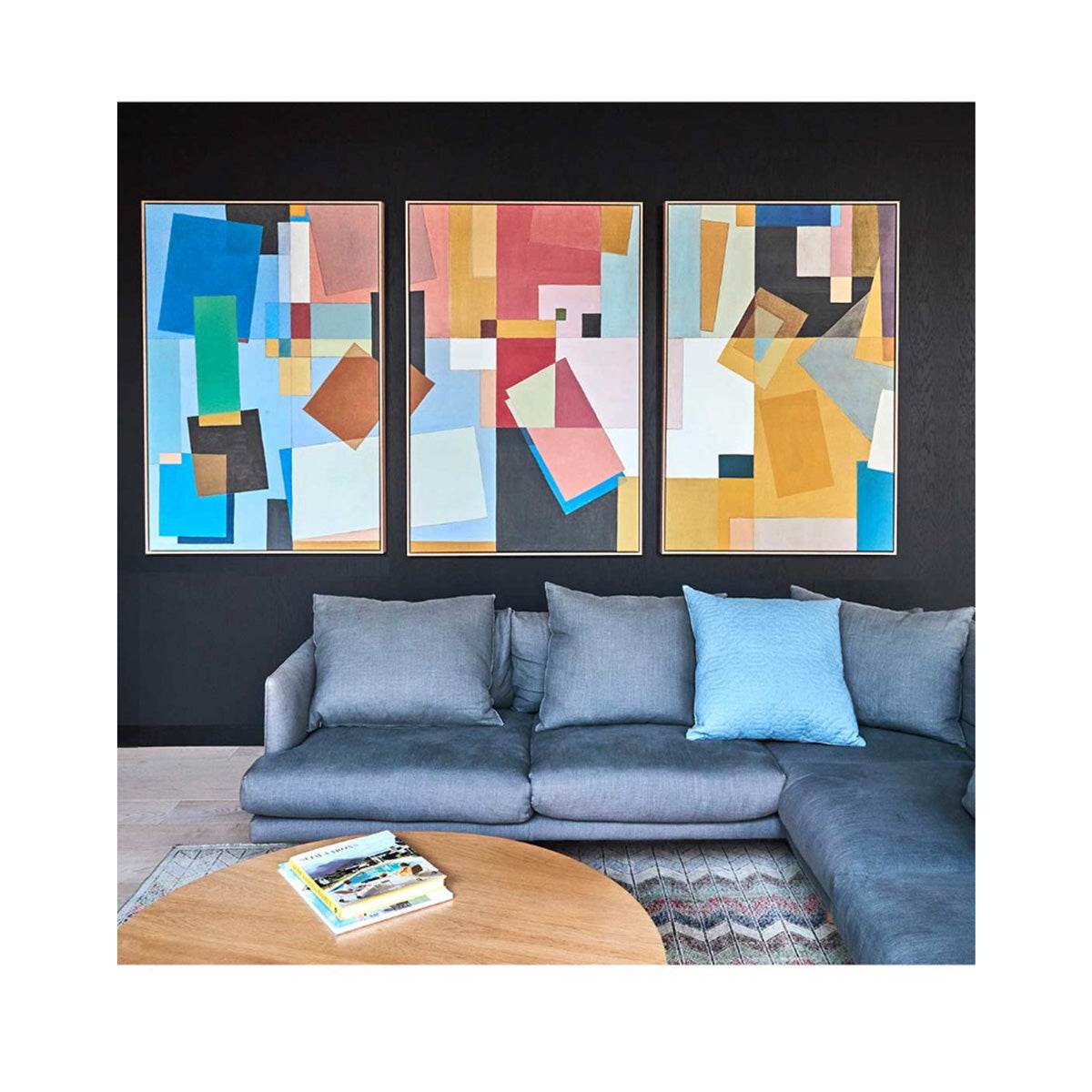 Colour Play Blue, Red & Yellow artwork framed in raw oak on a black living room wall