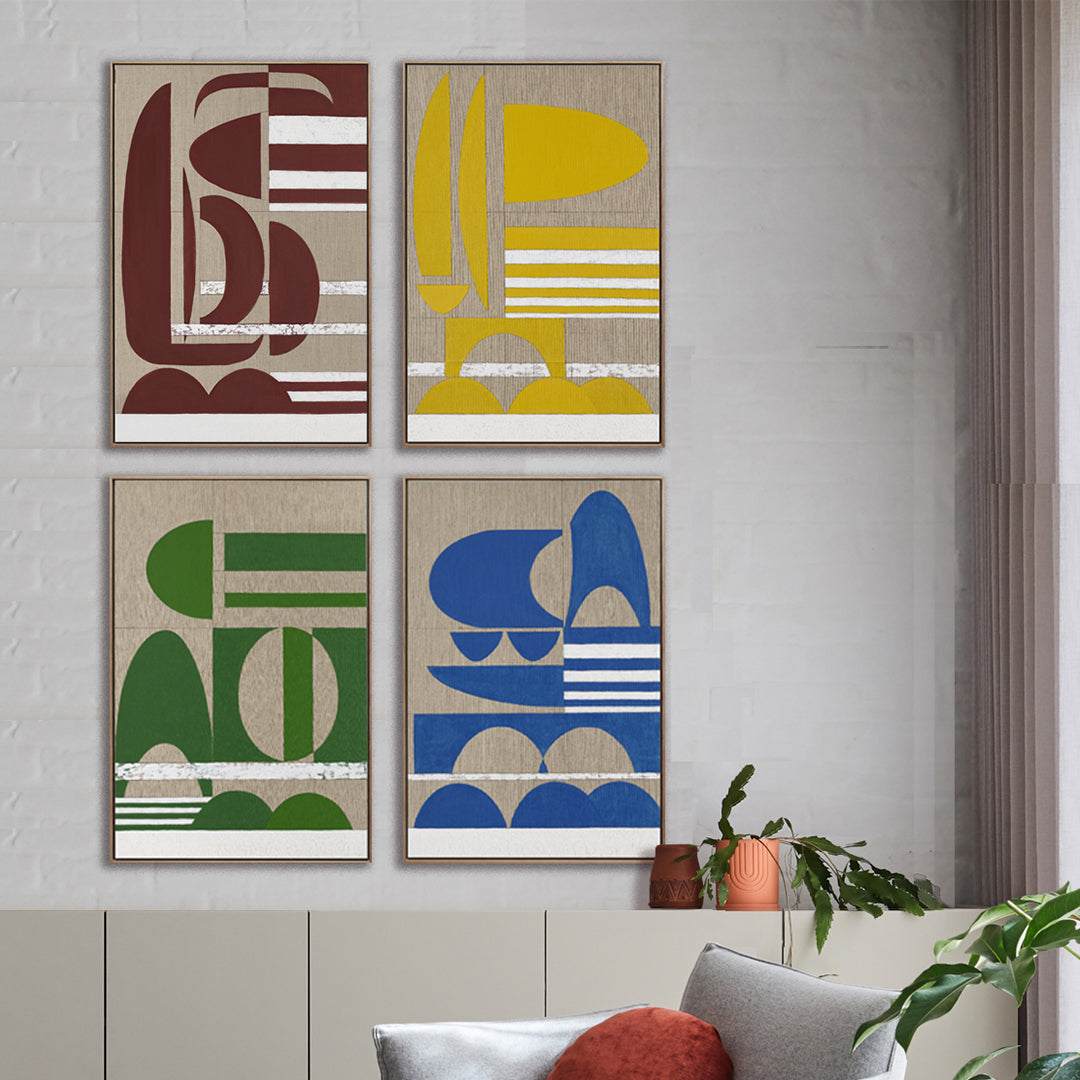 A set of four abstract stucco artworks in apple green, crimson, greek blue, and yellow, displayed above a modern living room sofa.