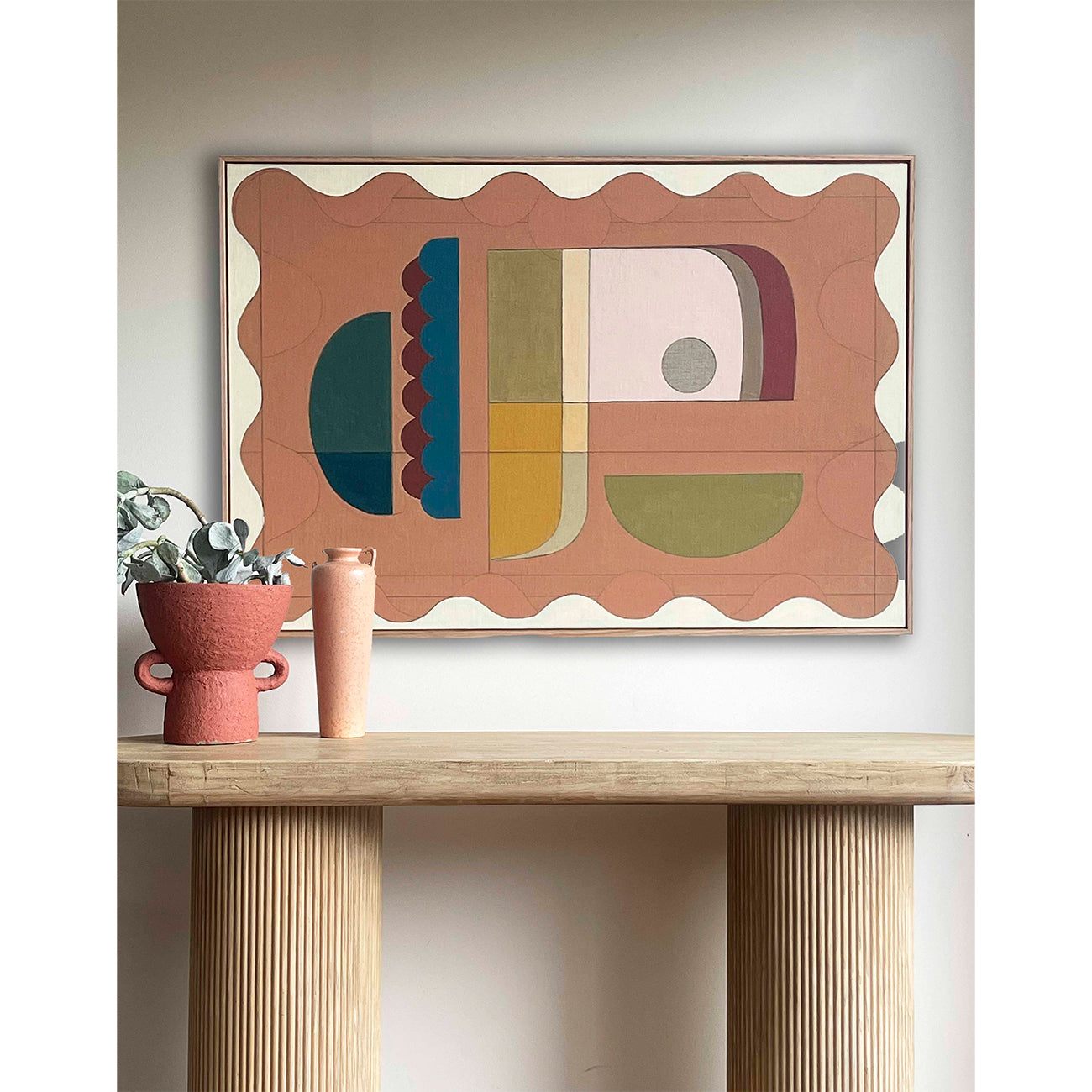 Large abstract wall art above sofa in modern living room with neutral styling