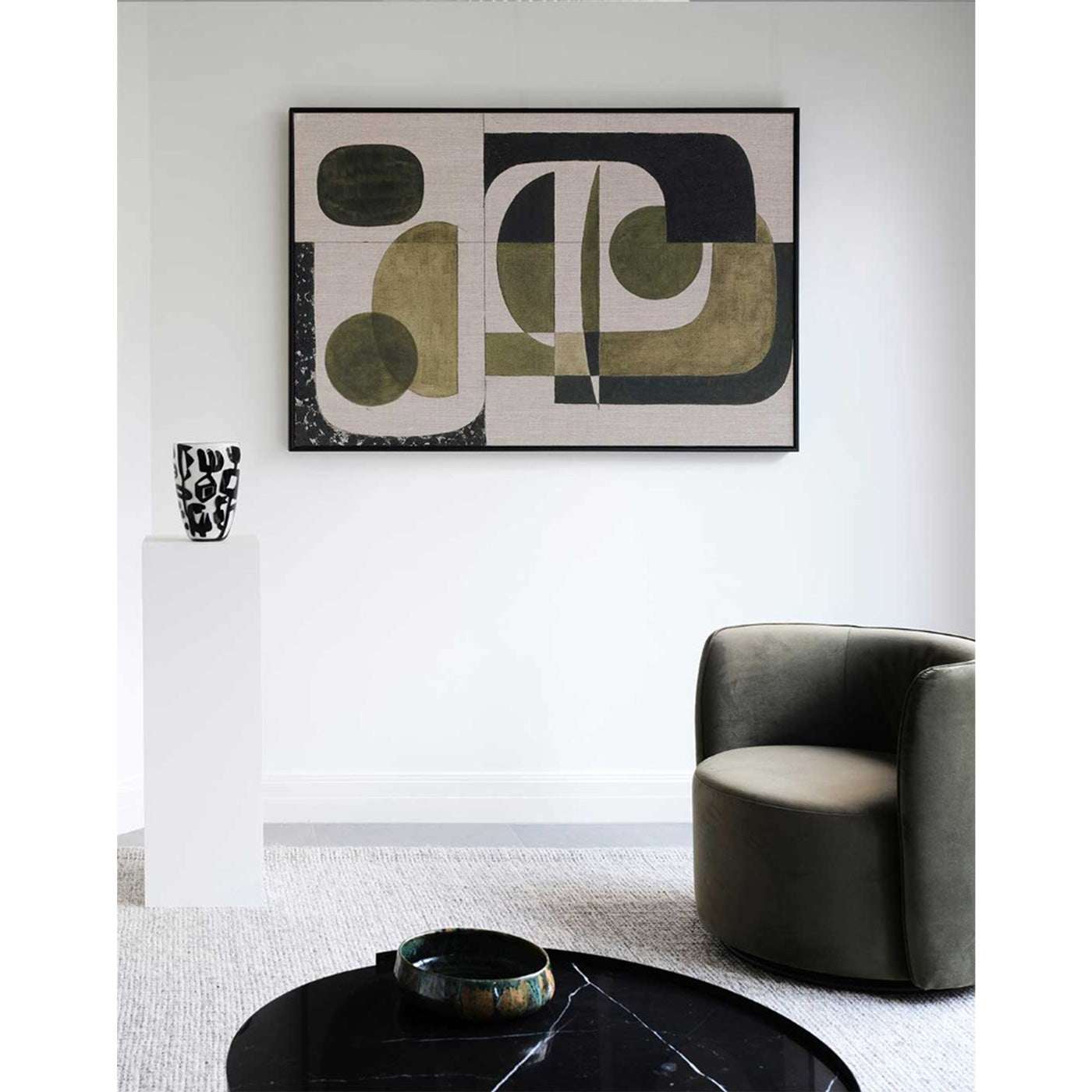 Large olive green wall art above sofa in modern living room