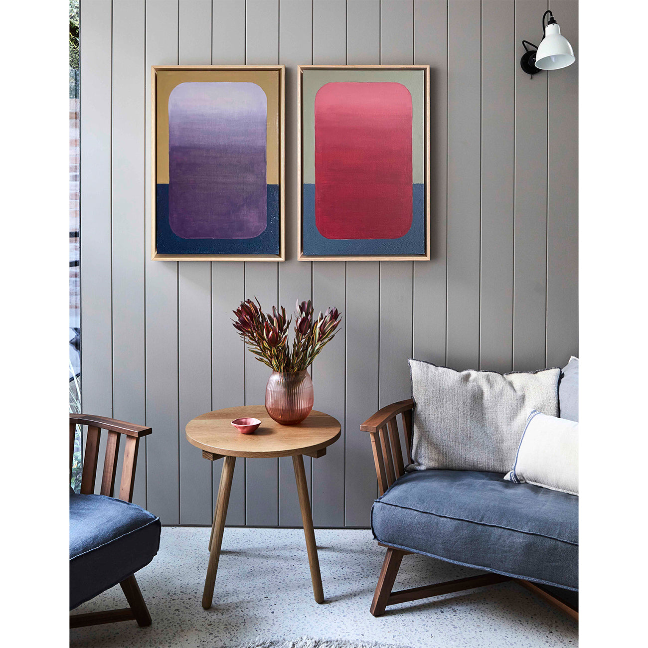 Large red abstract wall art above sofa in modern living room