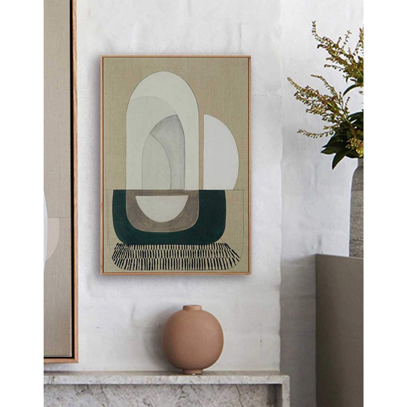 A framed Giclee print featuring an abstract design with interconnecting arches, displayed on a wall above a beige console table.