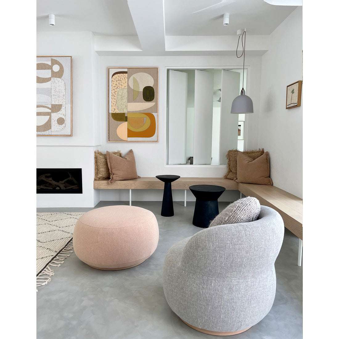 A framed Giclee print featuring abstract art with a sensual warm tonal color palette, displayed in a modern living room setting.