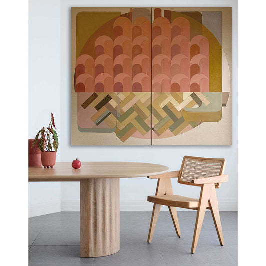 Large diptych wall art above sofa in modern living room